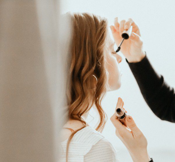 makeup artist applying they're real mascara dupe to client