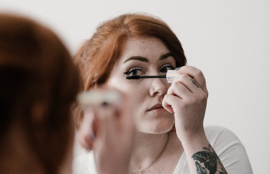 woman applying they're real mascara dupe to eyelashes